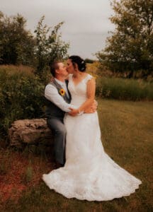 A man and woman kissing on the cheek.