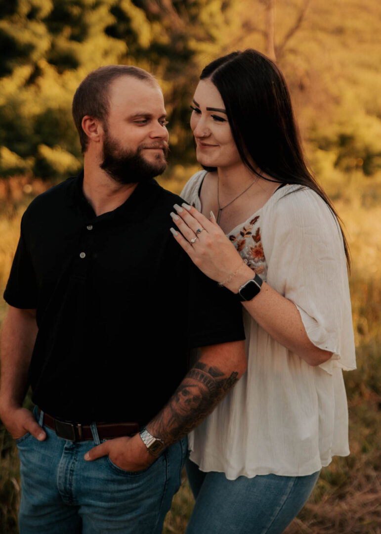 A man and woman standing next to each other.